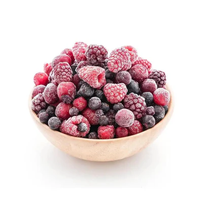 A bowl filled with frozen mixed berries including strawberries and blueberries